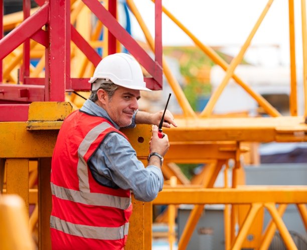Technician working with industrial equipment representing controls integration