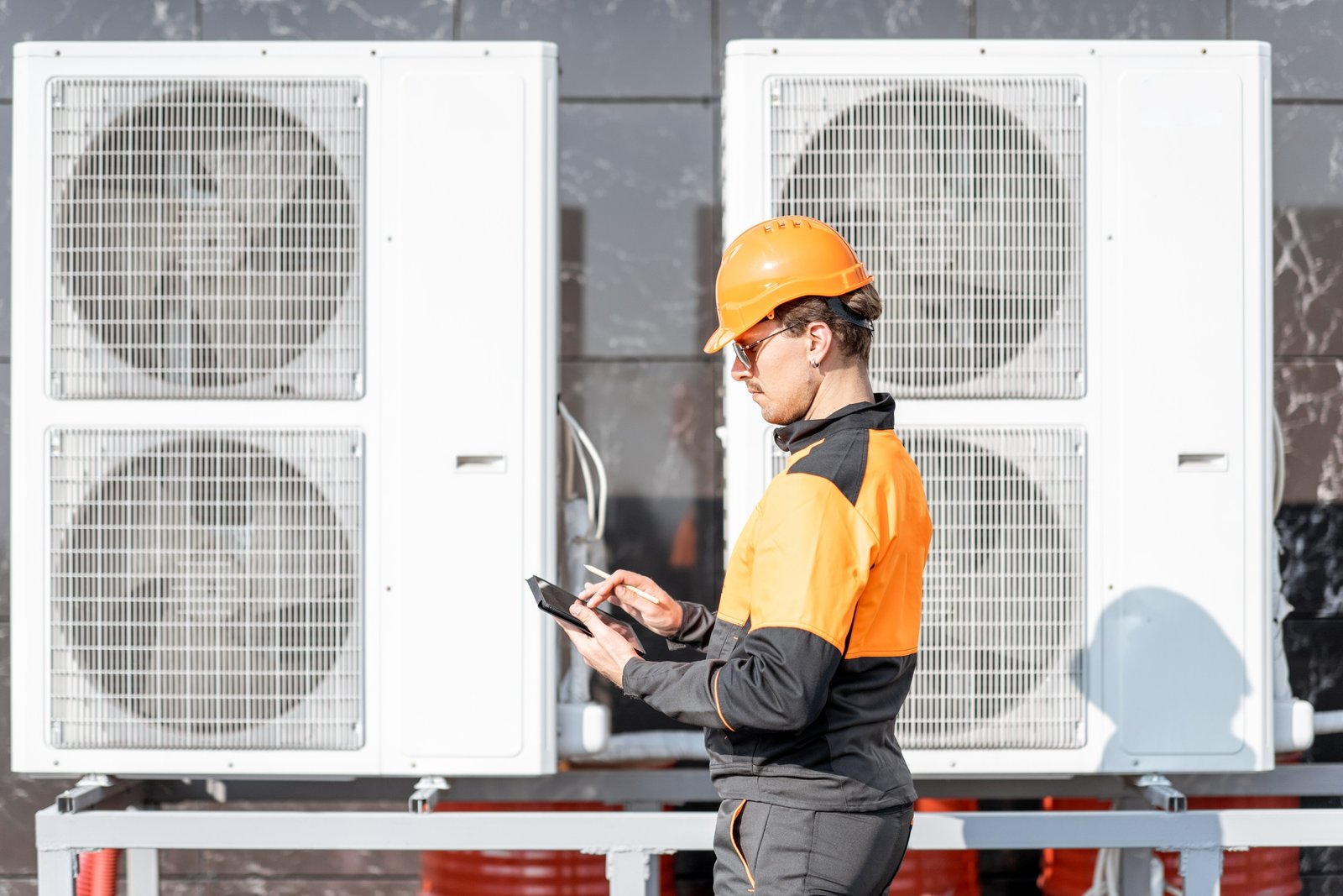 Hands-on HVAC training workshop with instructor and technical team