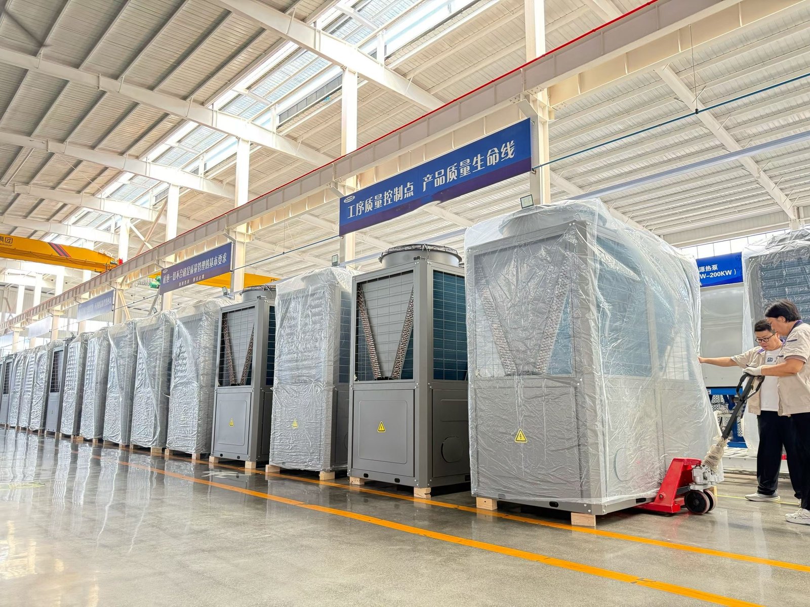Industrial heat pump and heat recovery system in a sludge drying facility