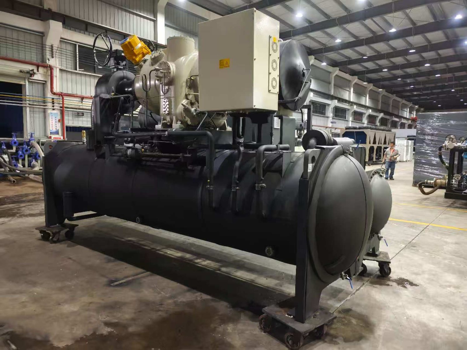 Large-scale industrial cooling system with blue pipes and machinery