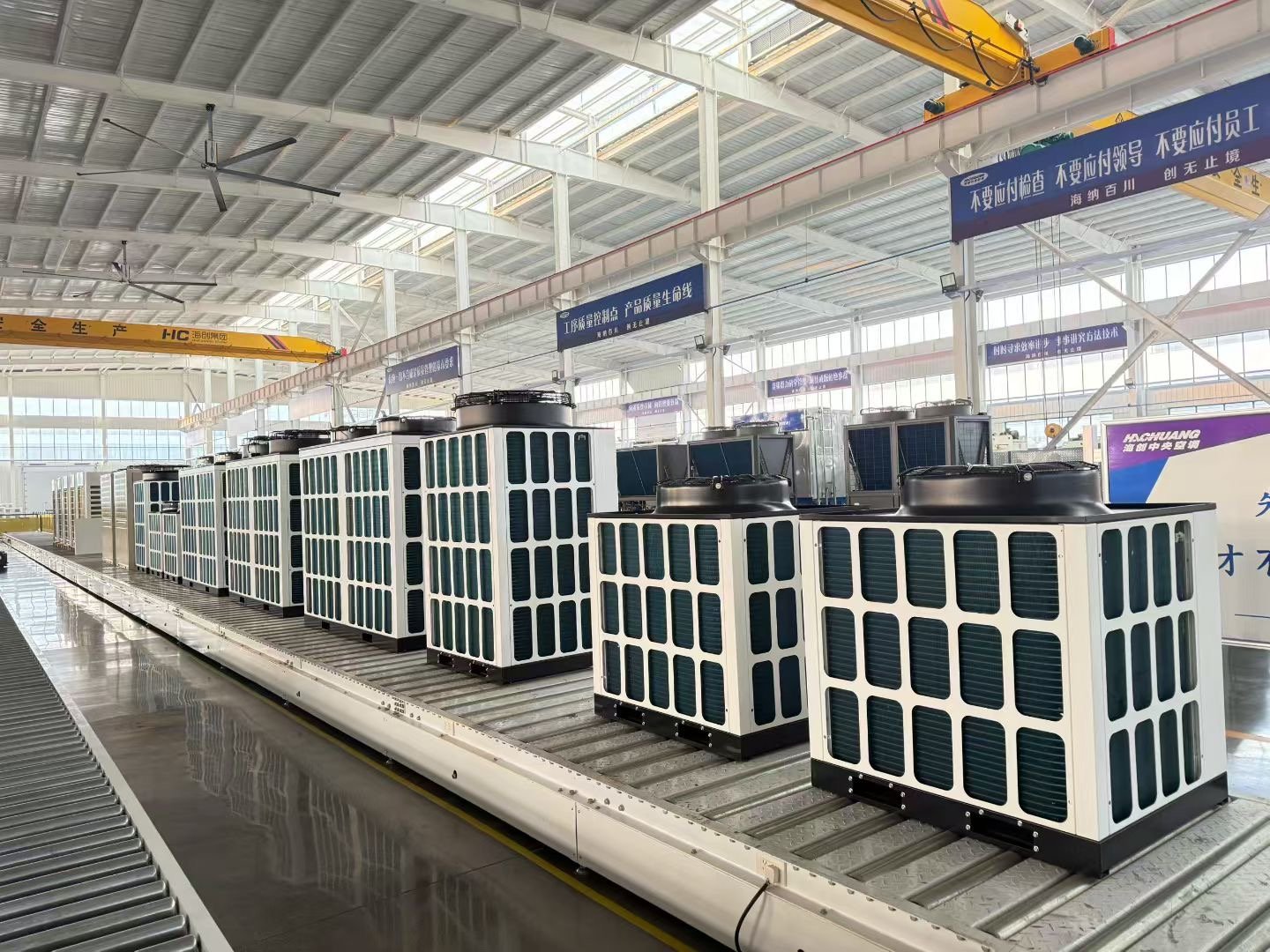 Large aircraft sitting inside an airport maintenance hangar