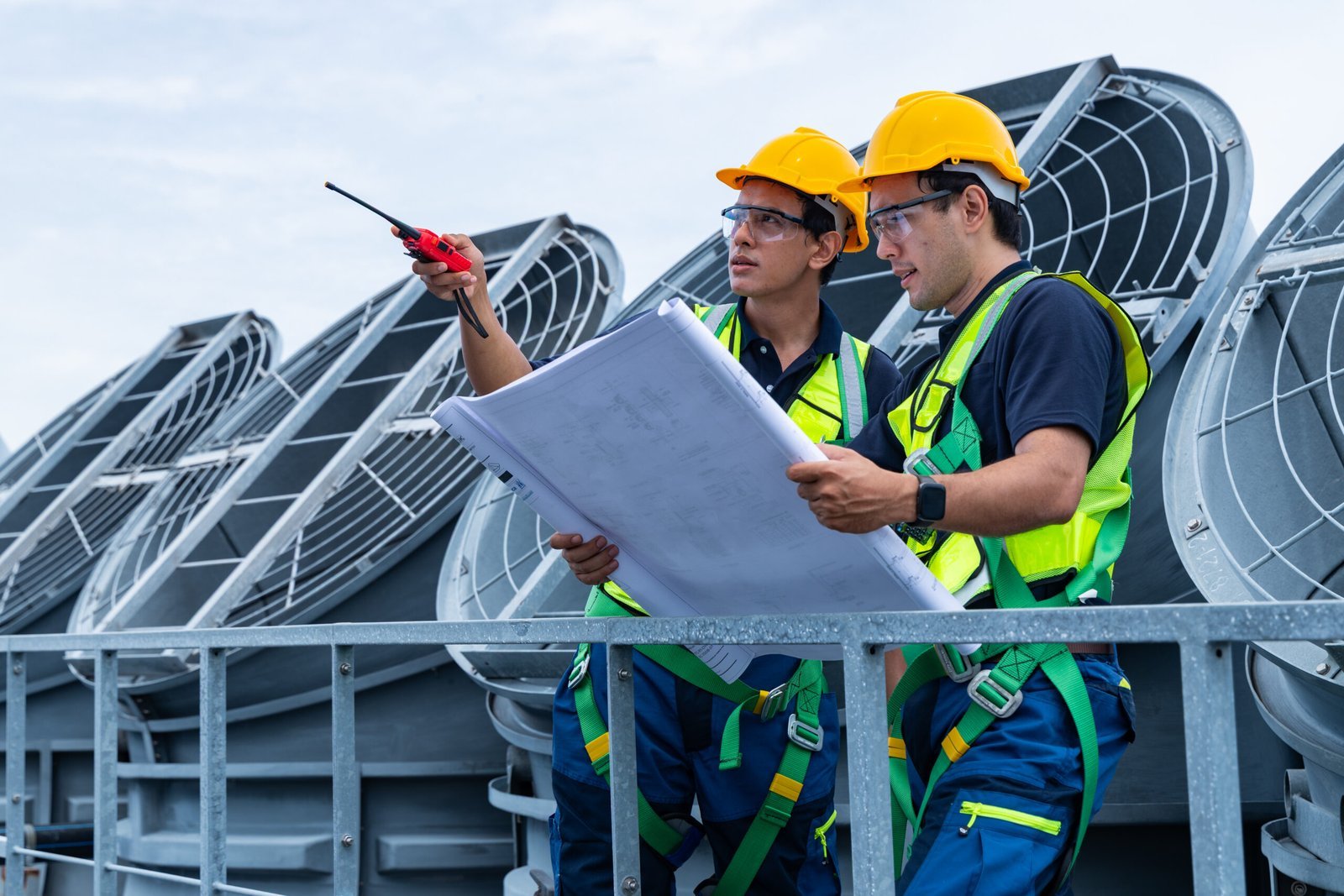 Engineers reviewing HVAC project documentation